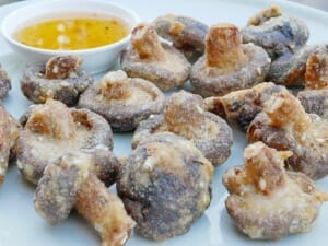 Fried Shiitake Mushrooms served with a side of garlic butter